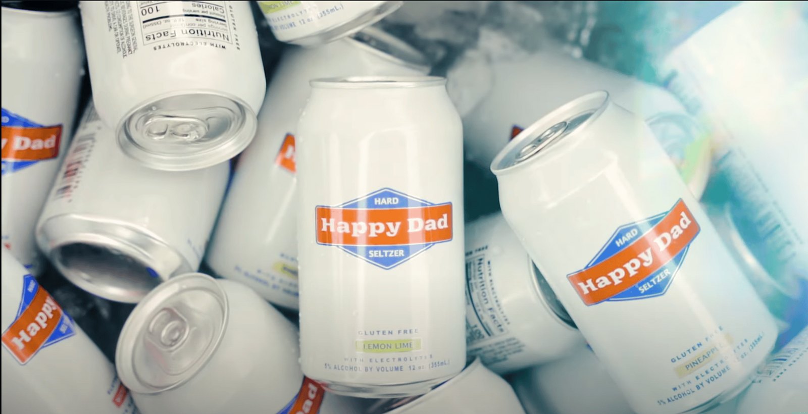 Happy Dad cans packed in ice at the tailgate