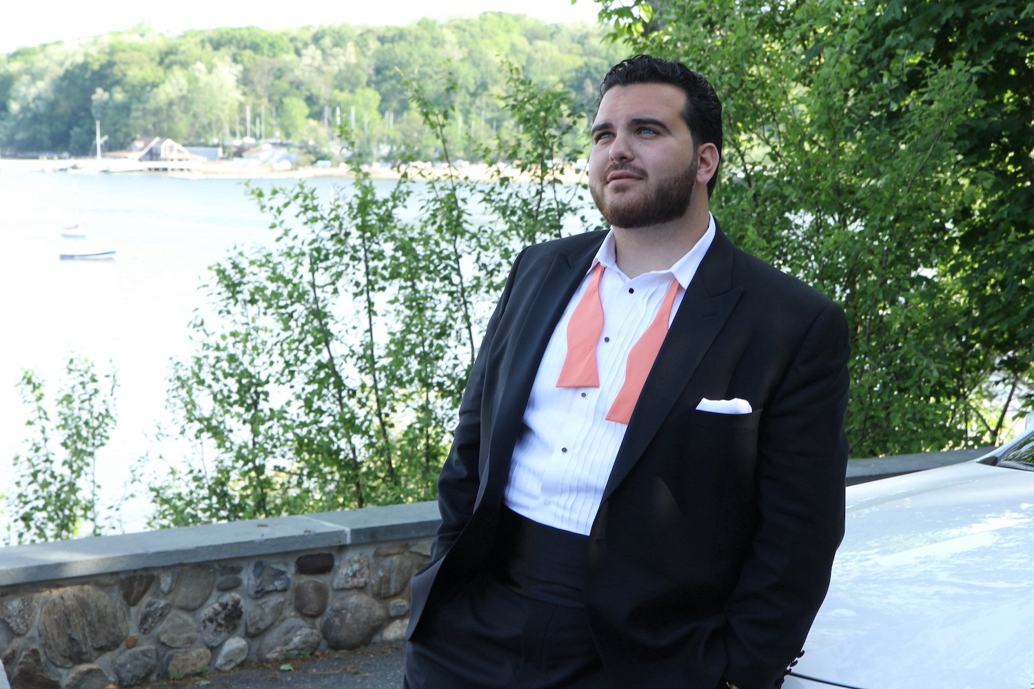 Sal Valentinetti in a tuxedo beside the water