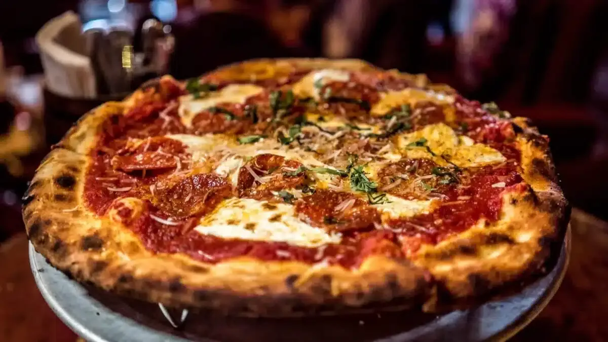 A pizza on a restaurant table